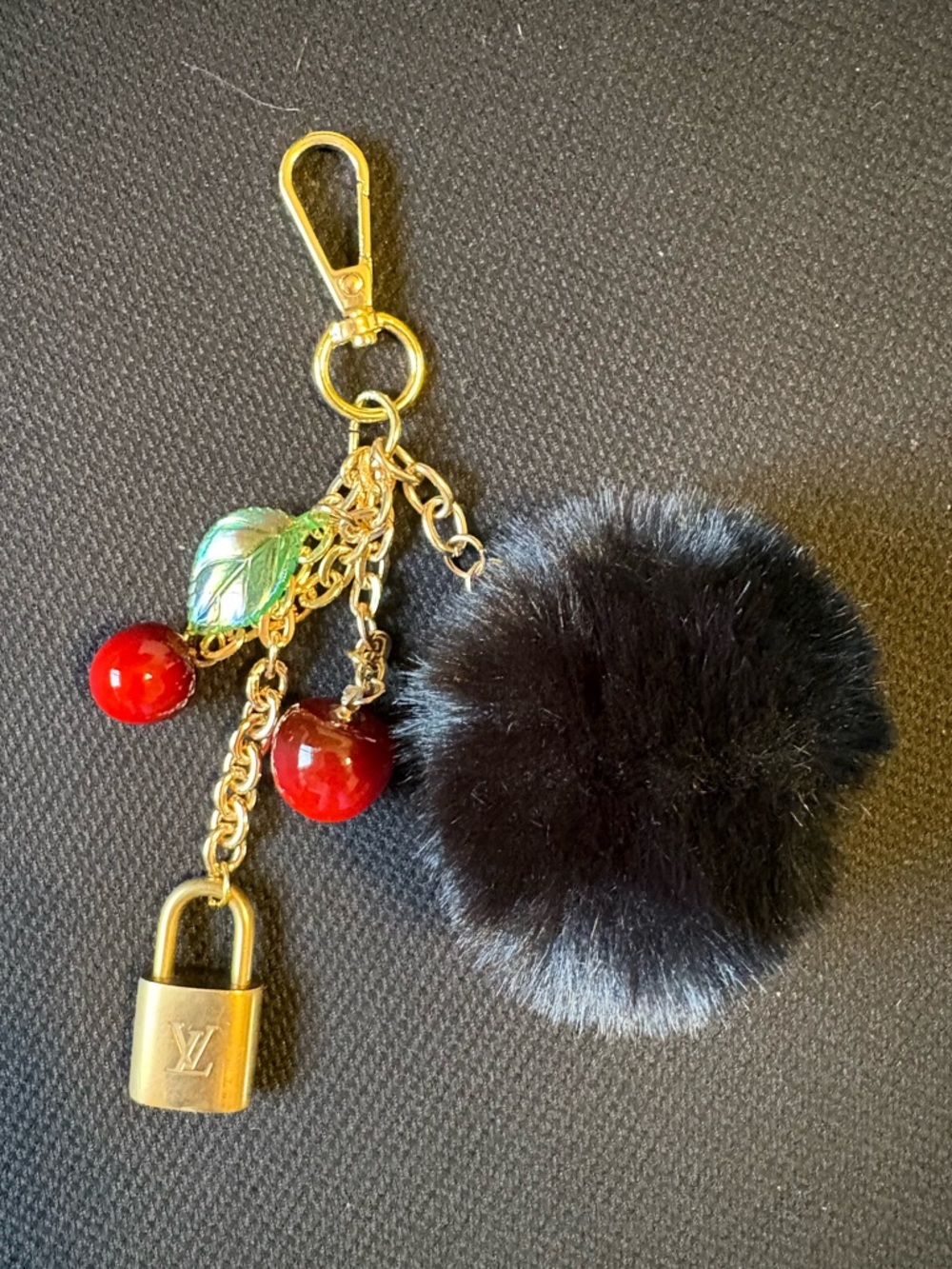 Authentic Louis Vuitton brass lock with unbranded charms and puff ball (No Key)